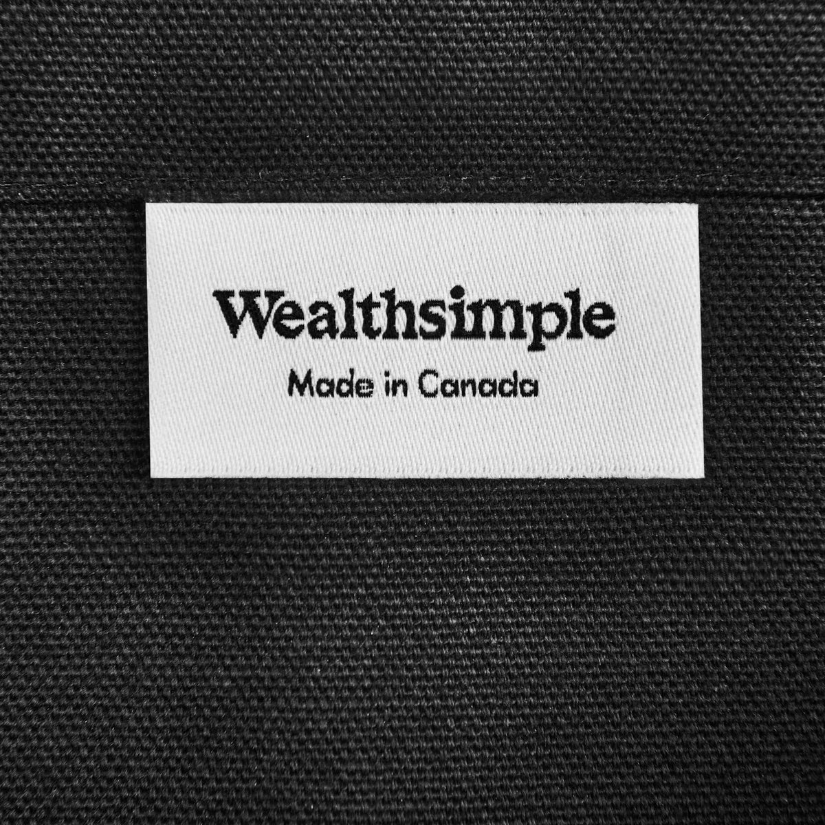 A tote bag with the word “Holdings.”